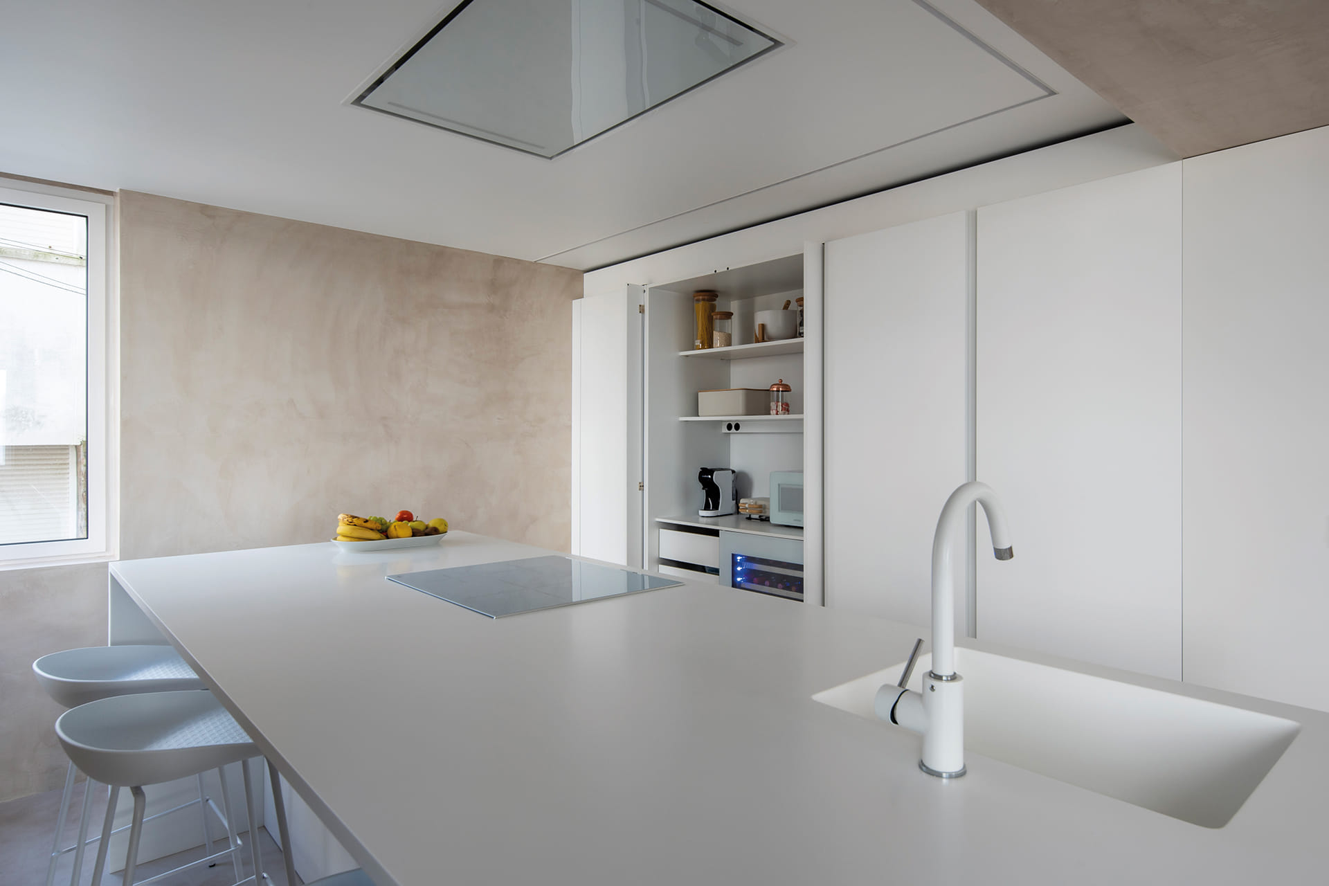 White Santos kitchen with island and tall units