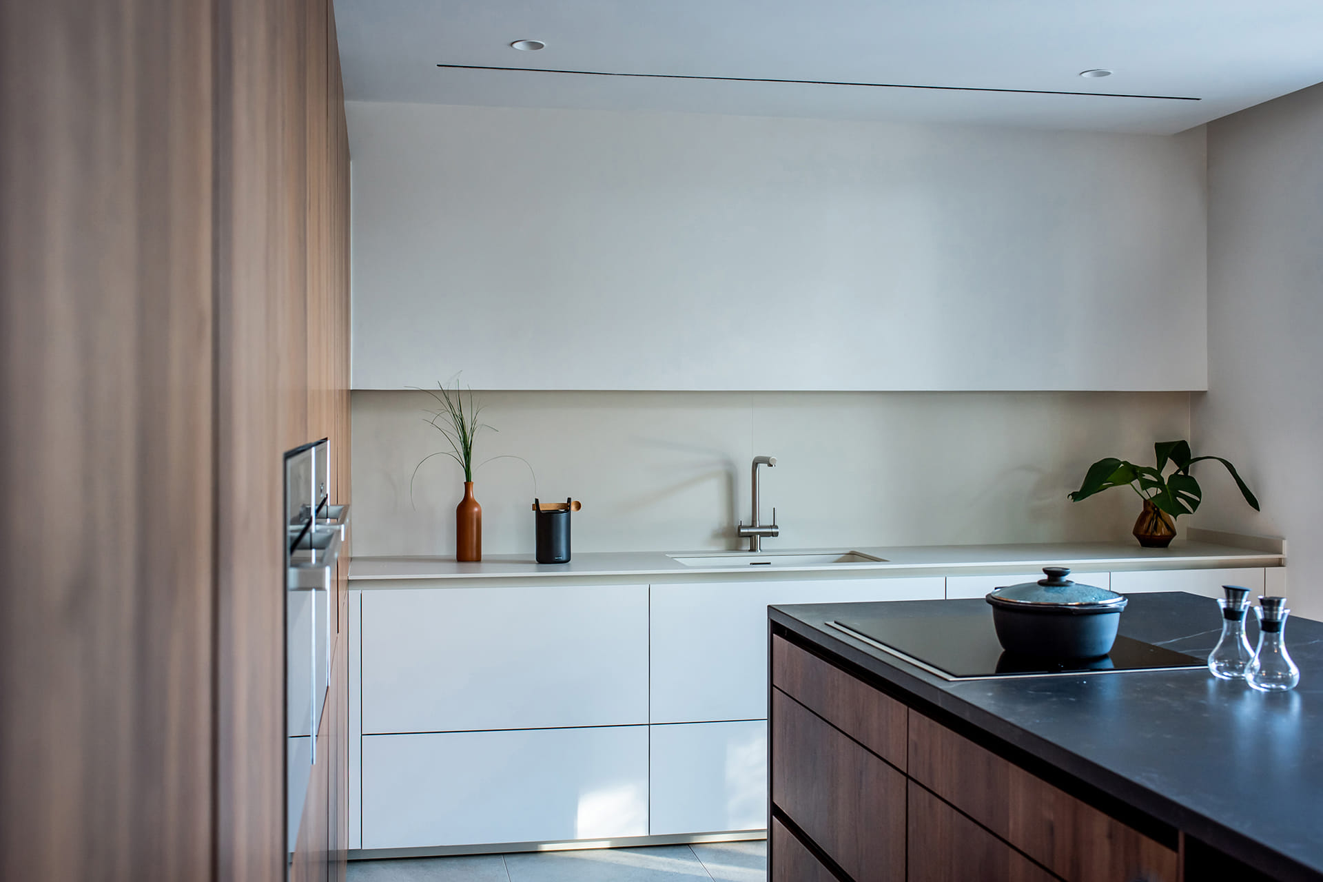 Santos white kitchen furniture in an L-shaped layout
