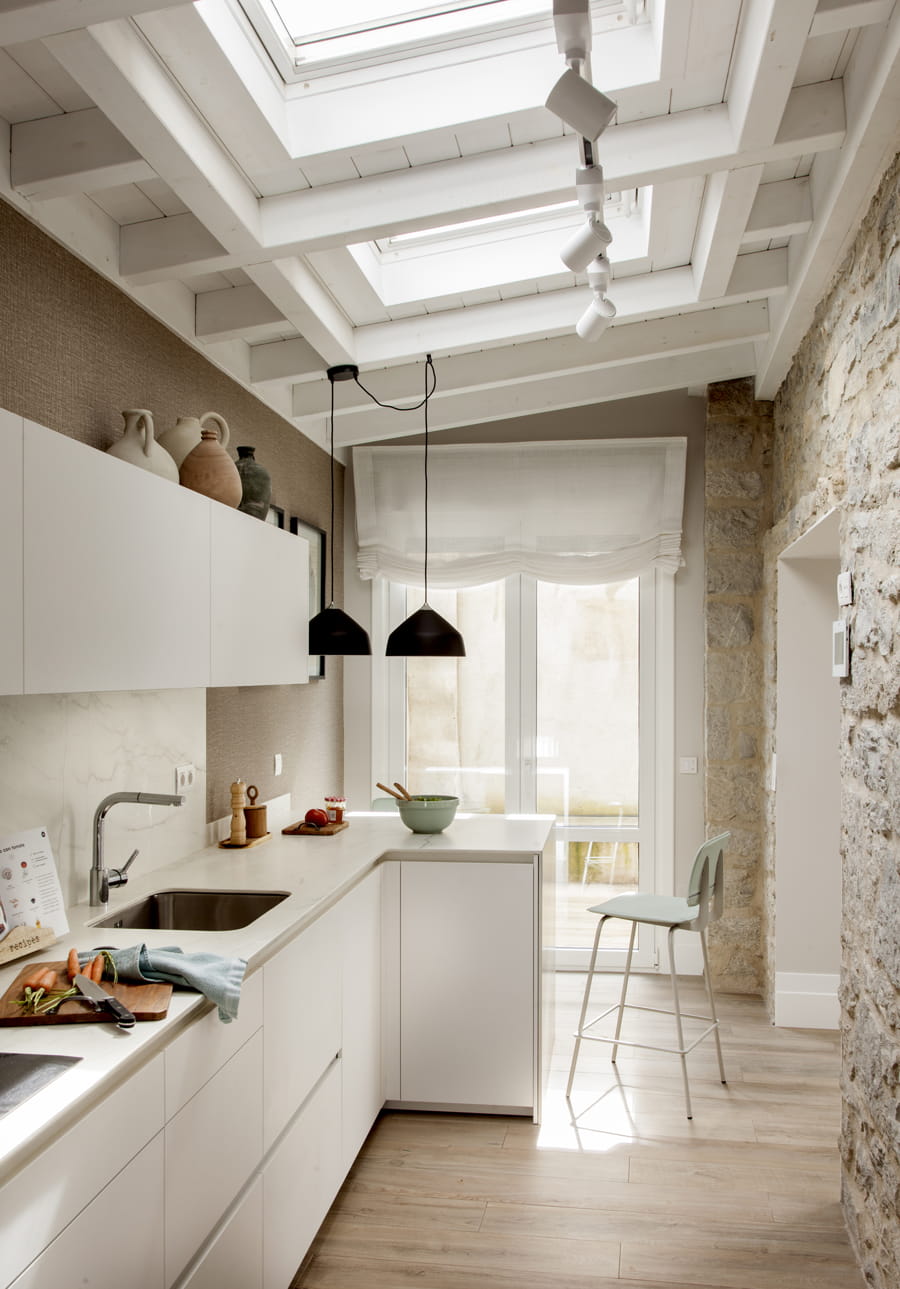 Home with L-shaped white Santos kitchen