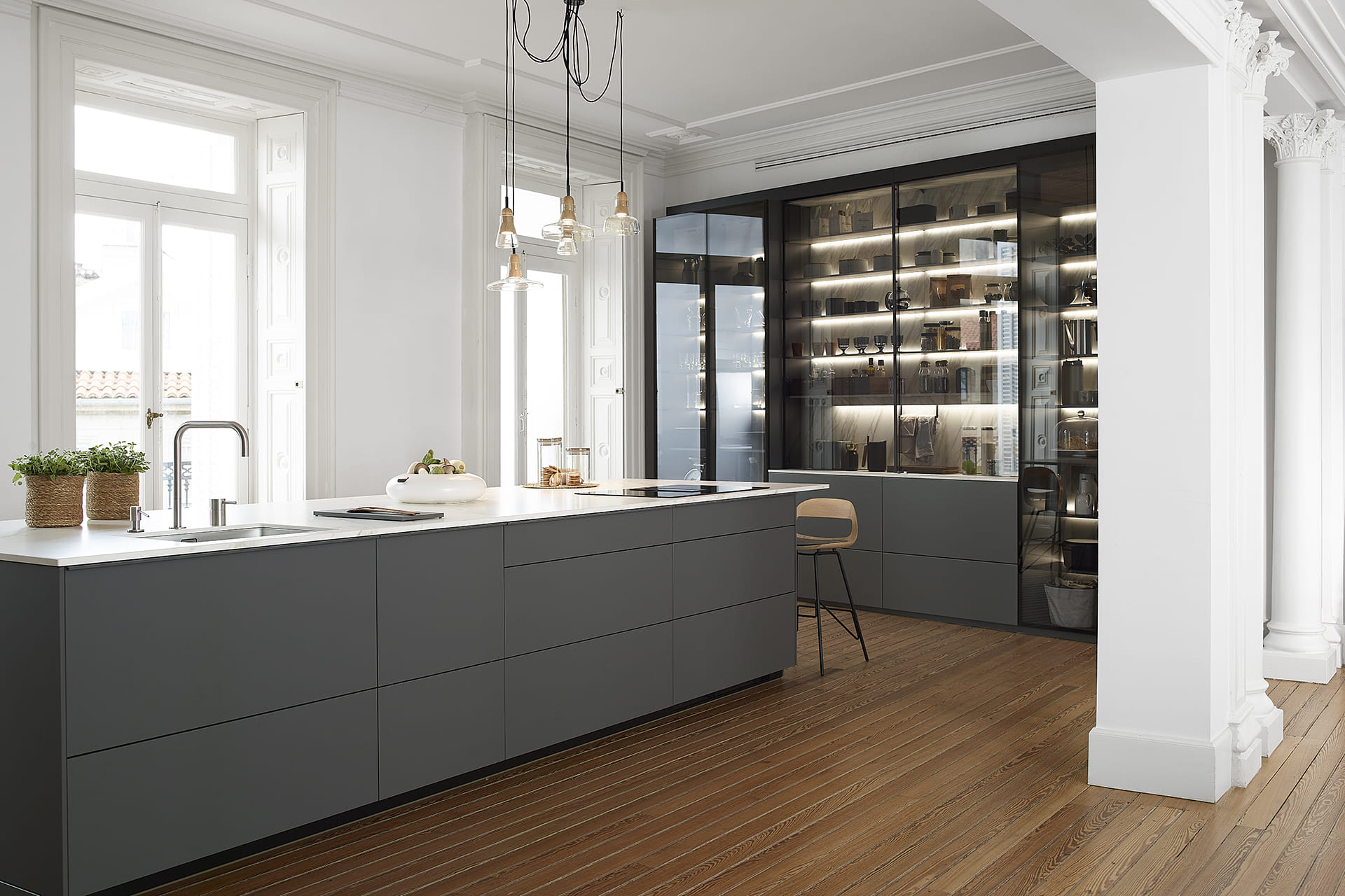 Grey Santos kitchen with island and glass door unit