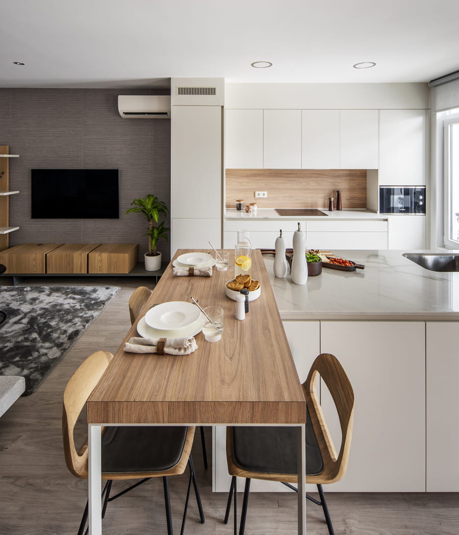 White Santos kitchen that opens out to the living room