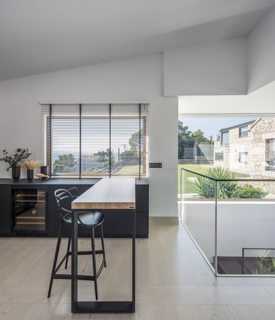 Open-plan Santos kitchen with auxiliary furniture