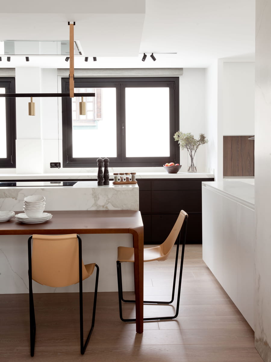 Kitchen with island in white, black and wood