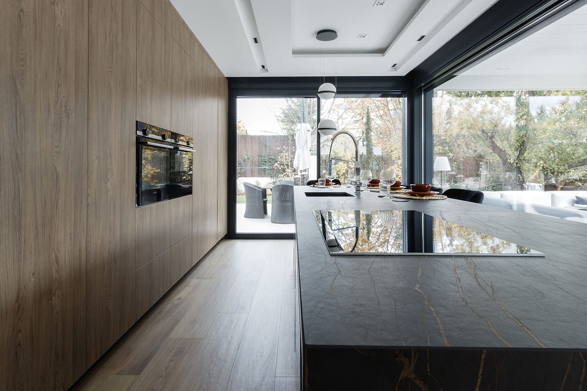 Open-plan Santos kitchen in black and wood