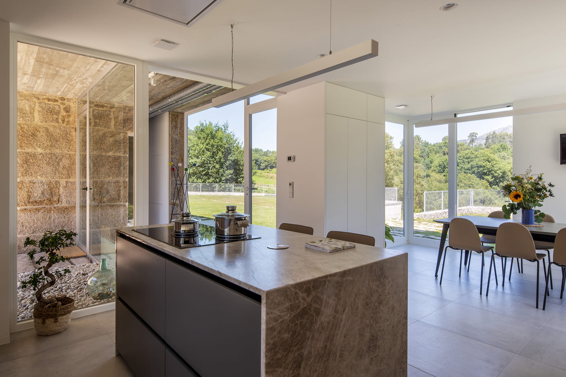 Open-plan Santos kitchen with stone island