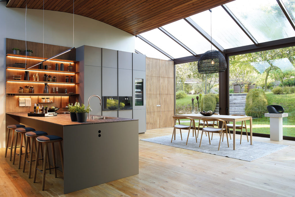 Grey Santos kitchen with peninsula, open to the dining room