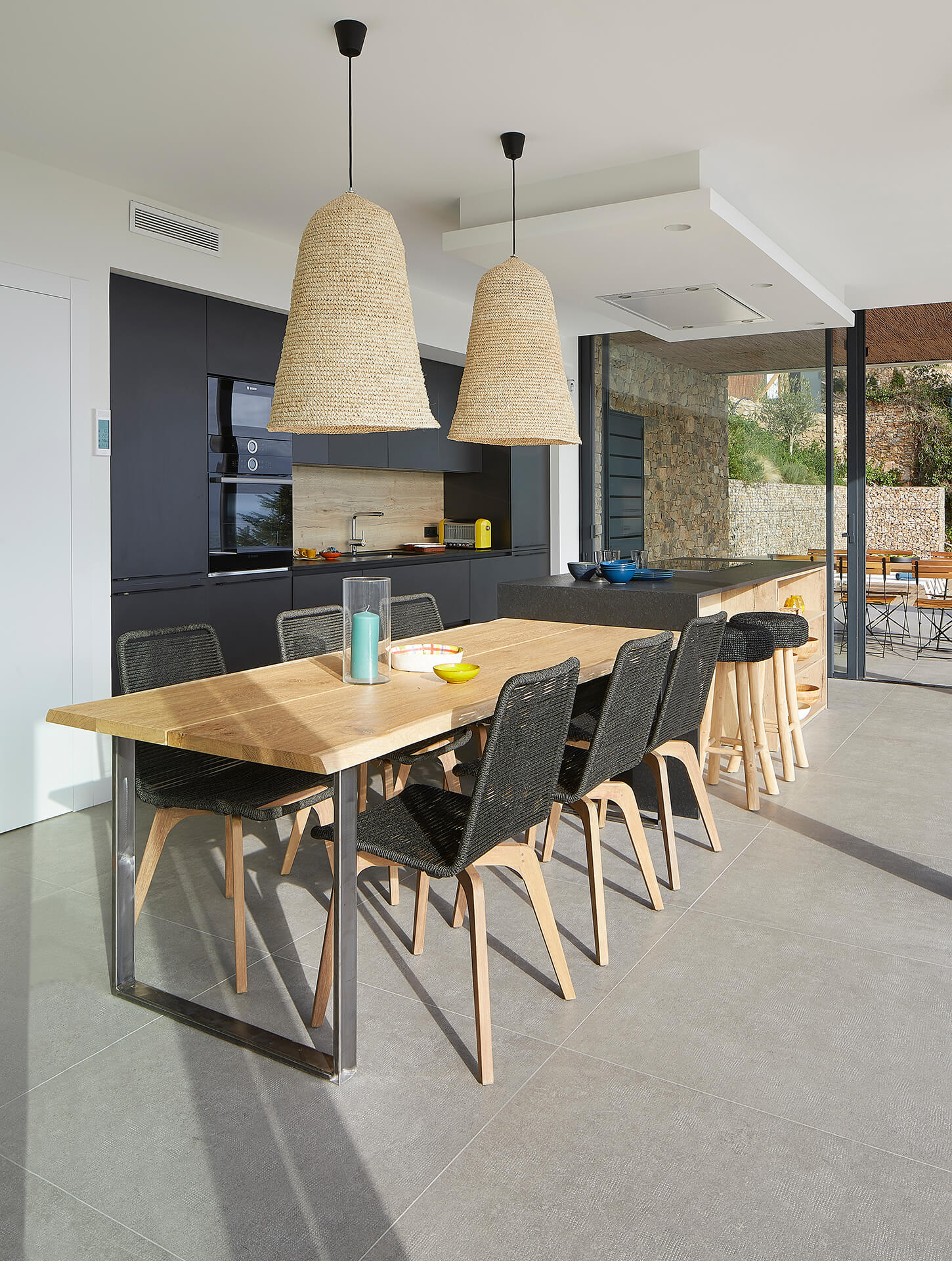 Santos kitchen finished in graphene and wooden table