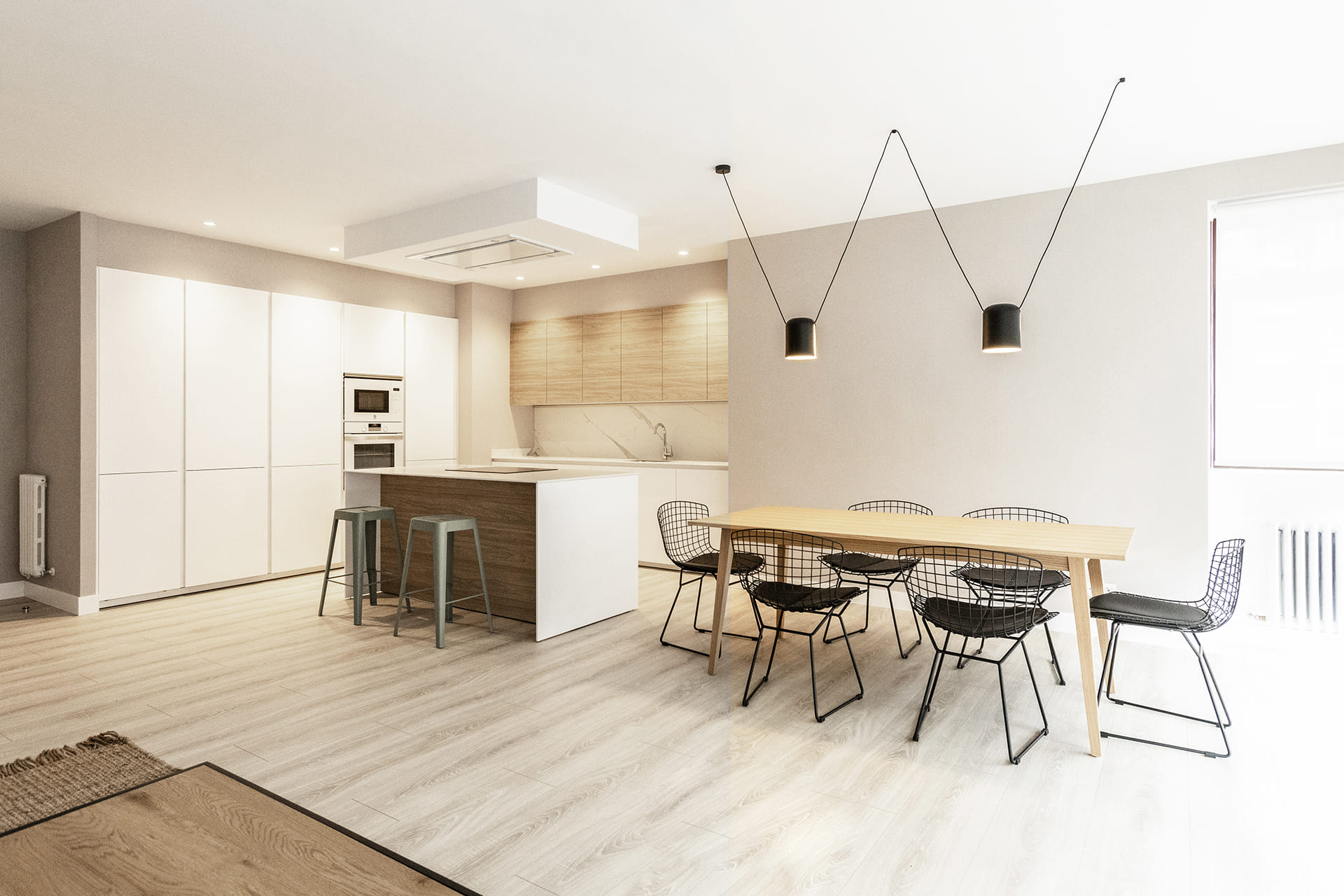 Open-plan Santos kitchen in white and wood