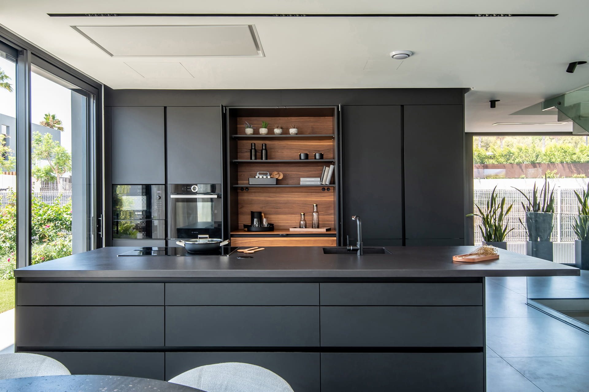 Home with black Santos kitchen with tall units