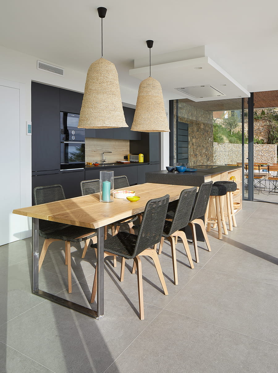 Home with black Santos kitchen and island