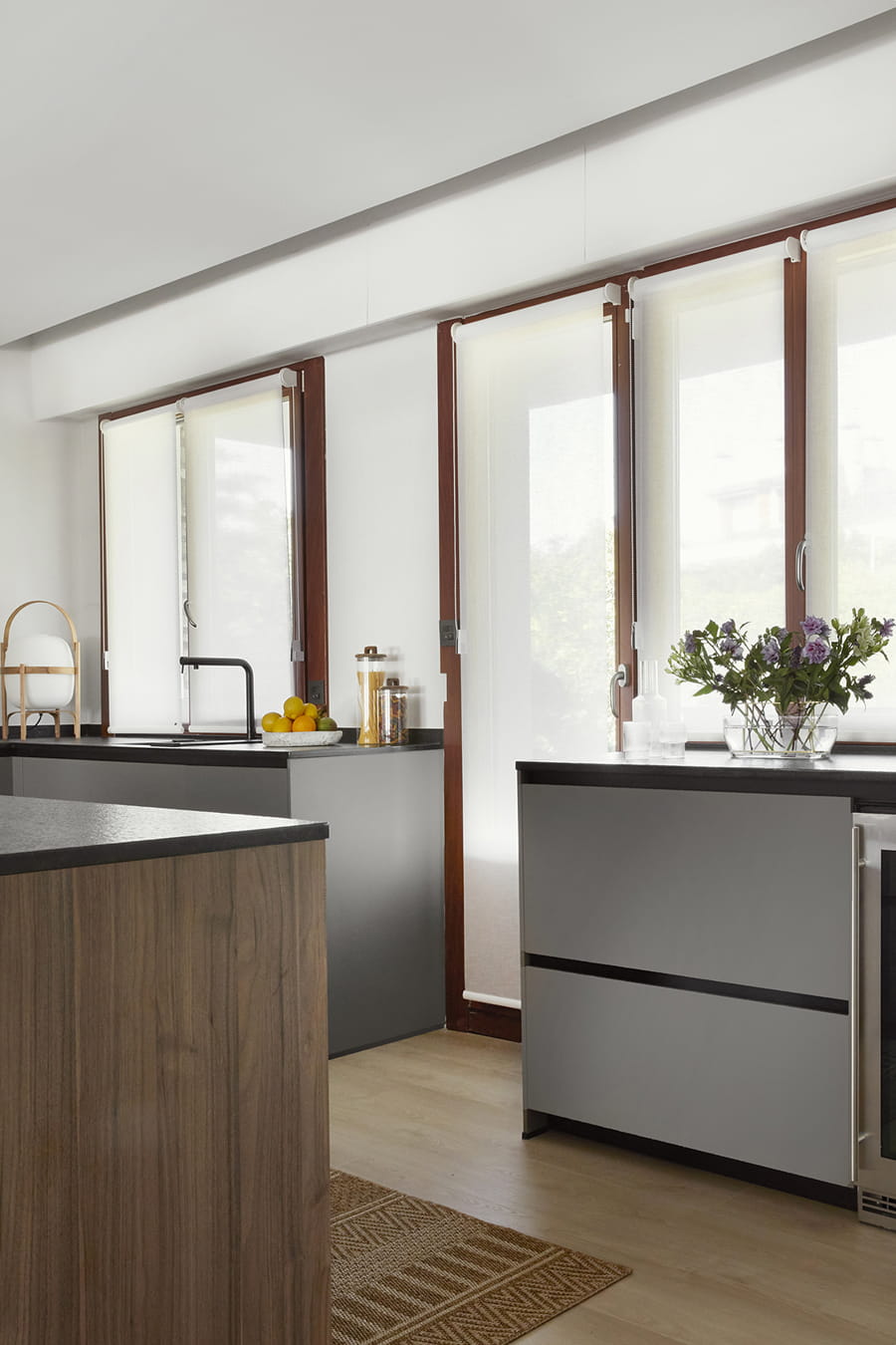 Grey and walnut wood kitchen, lighted with large windows, centre island, Santos.
