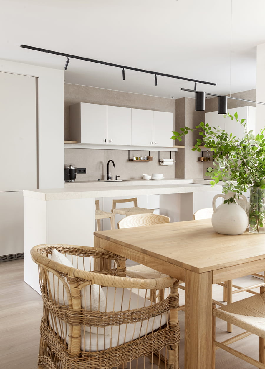 Cashmere kitchen with an island open to the lounge in a Santos project.