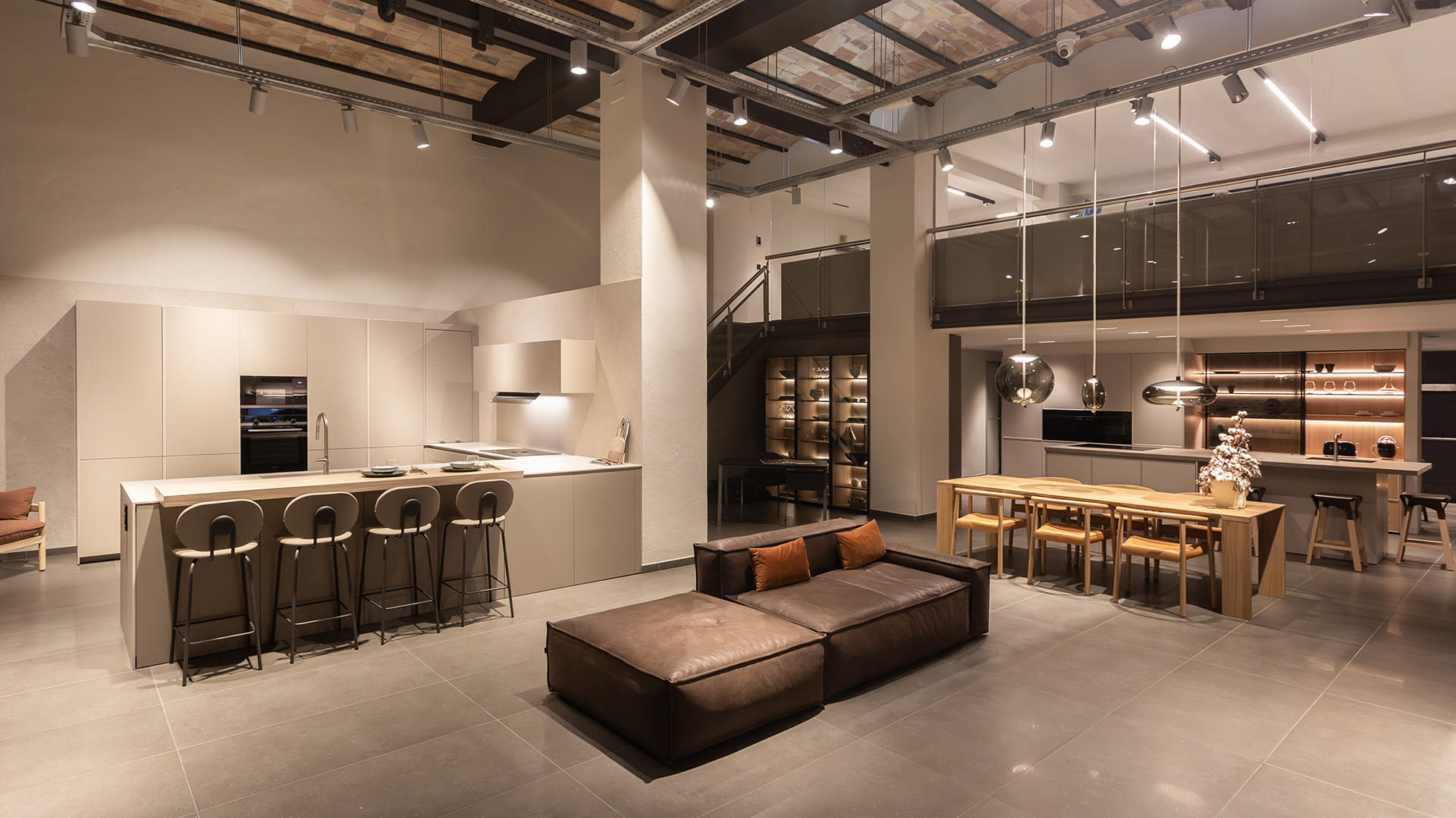 Kitchen and living zone at the Santos kitchen showroom in Girona.