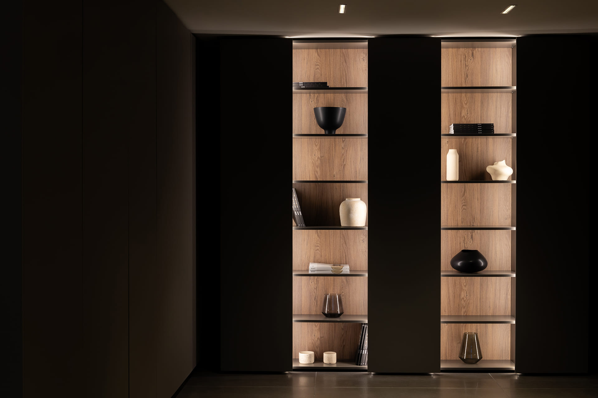 Glass door unit with smoked glass fronts at the Santos kitchen showroom in Girona.