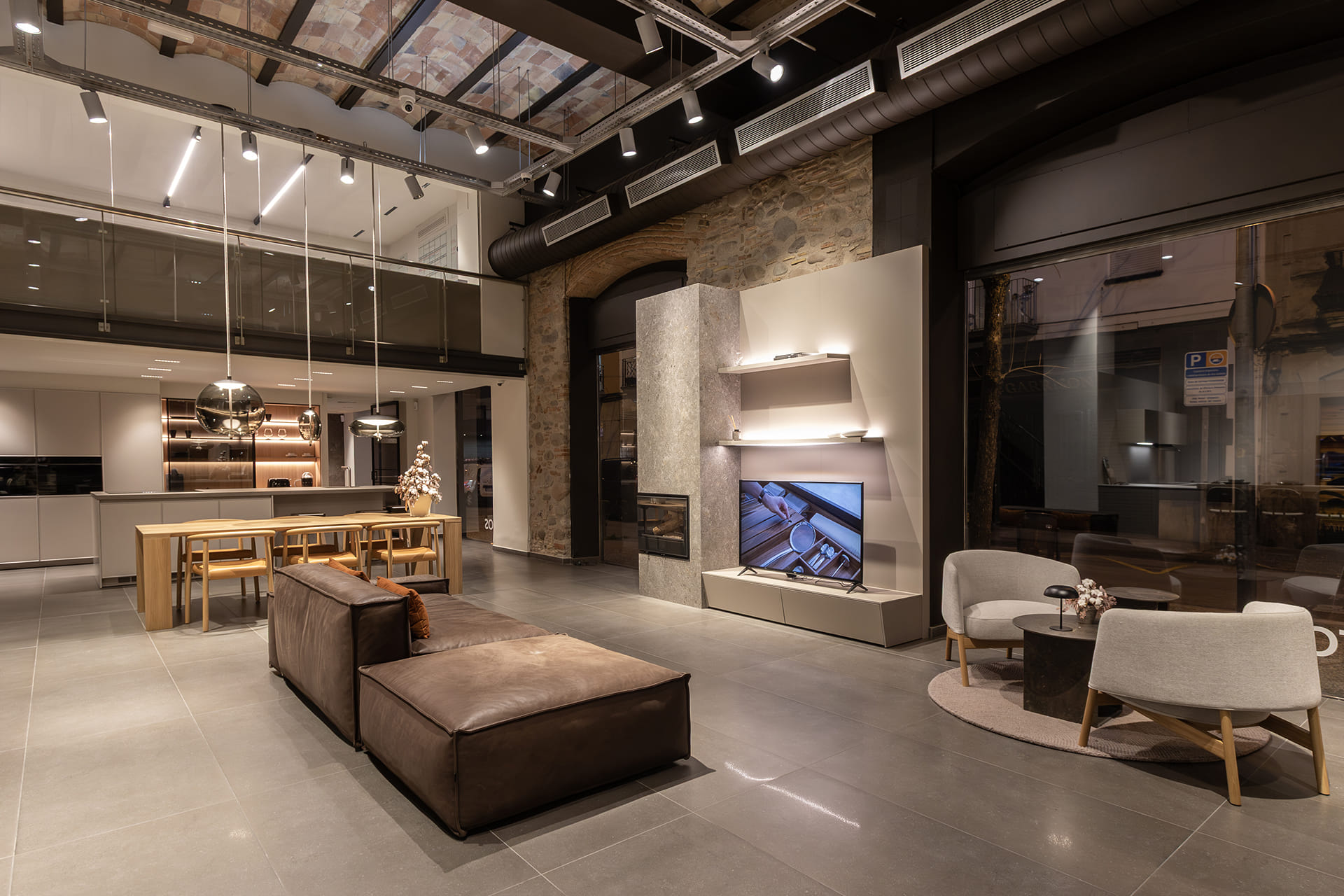 Living zone with Santos living furniture at the Santos kitchen showroom in Girona.