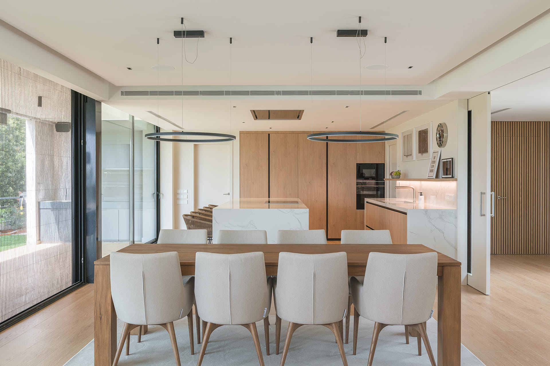 White Santos kitchen finished in Natural Oak and centre island.