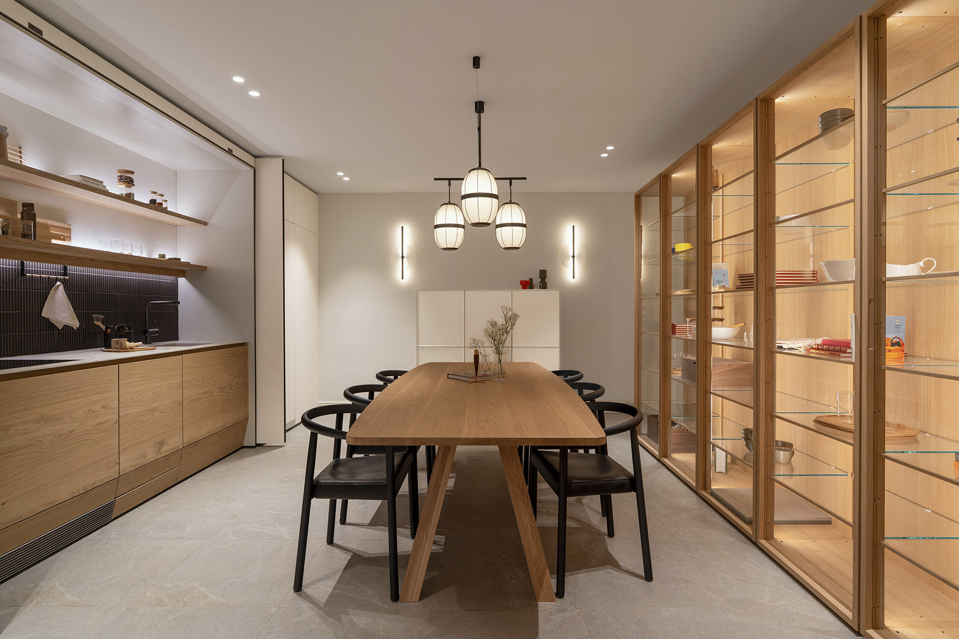 Single-wall kitchen with plinth drawers at the new Santos Kitchens showroom in Switzerland.