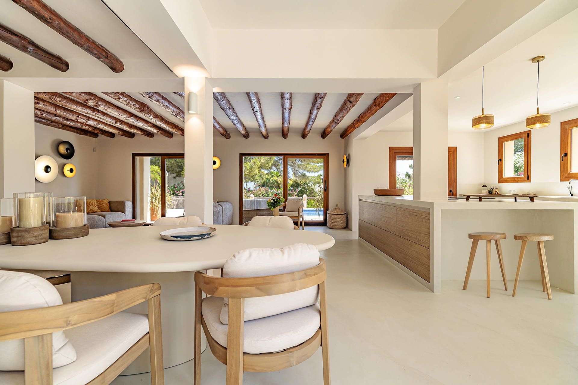 Dining area and lounge in a Santos kitchen open to the outside.