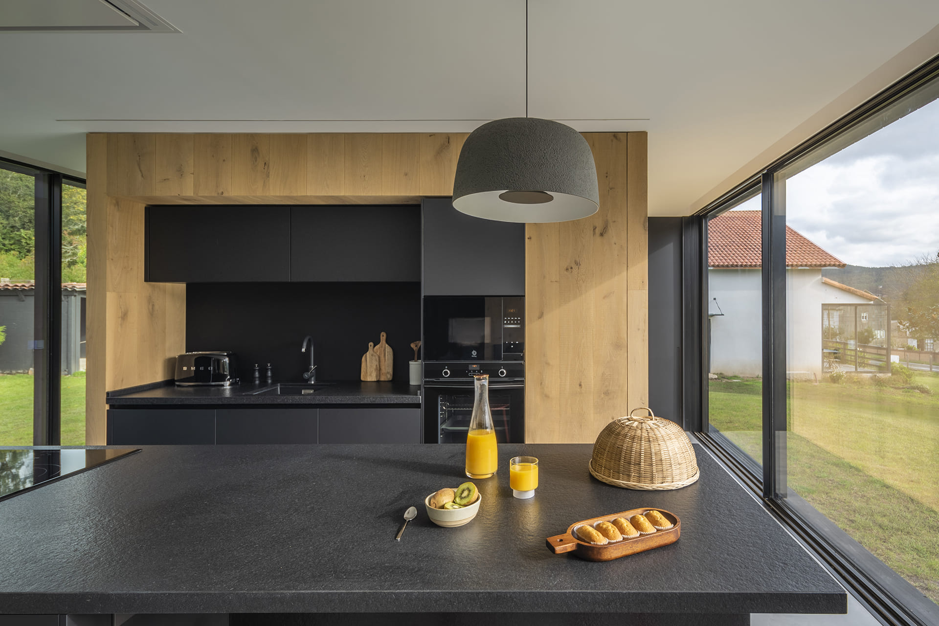 Close-up of a black granite kitchen island in a home with a Santos kitchen.
