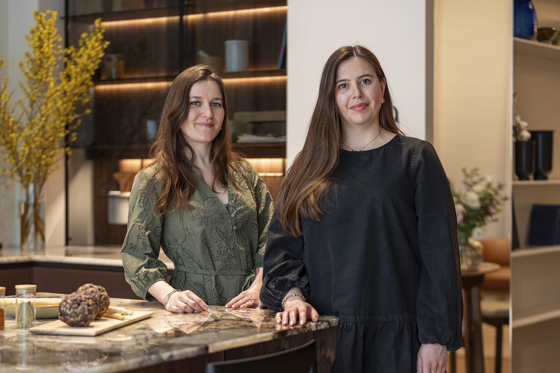 eba Genève showroom team next to a kitchen at the showroom in Switzerland.
