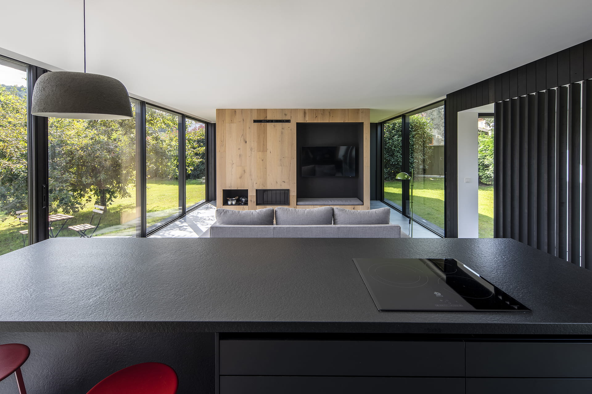 Kitchen island with black granite worktop in a Santos Kitchens project.