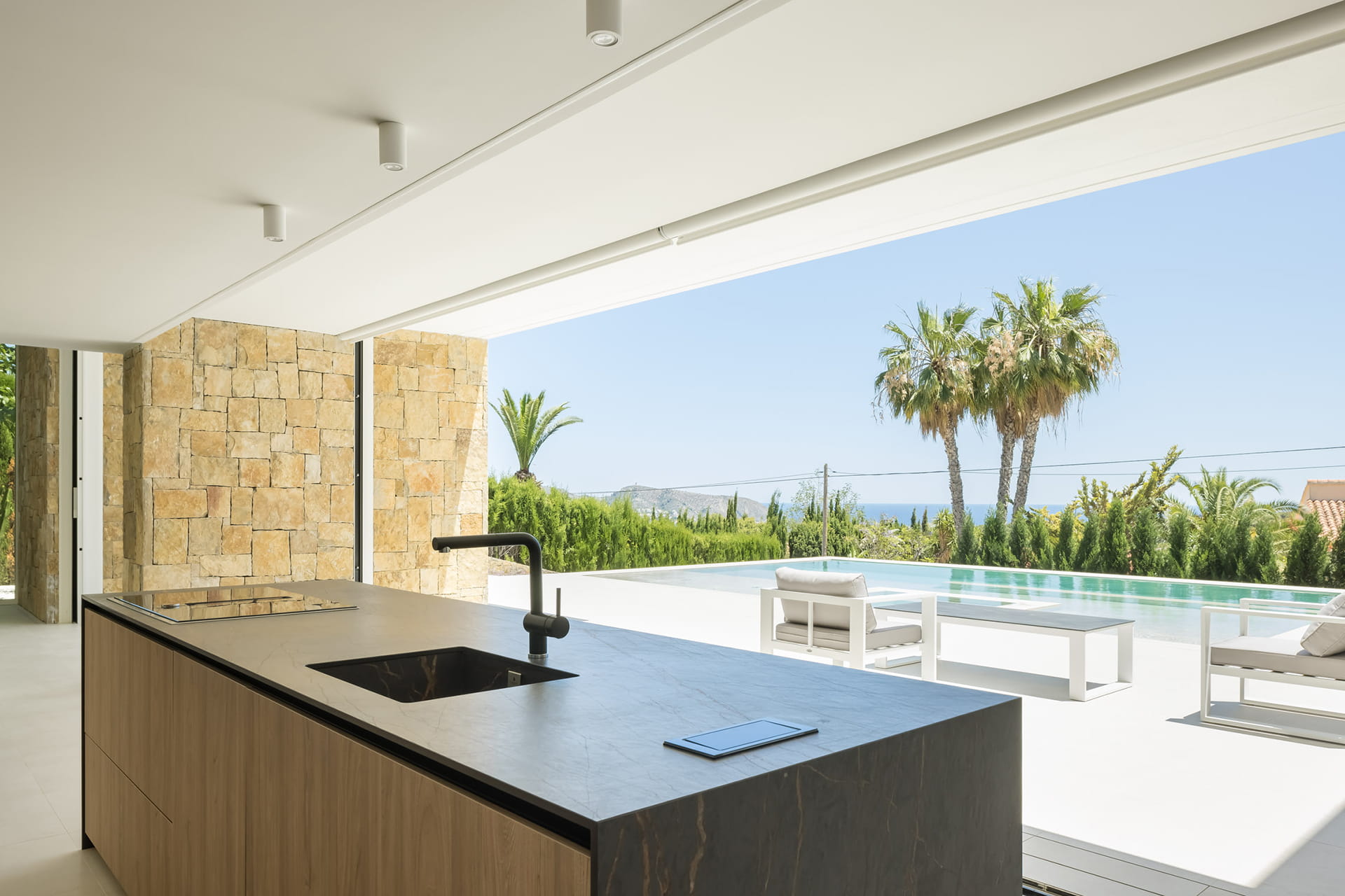 Kitchen island in a Santos Kitchens open to the outside.