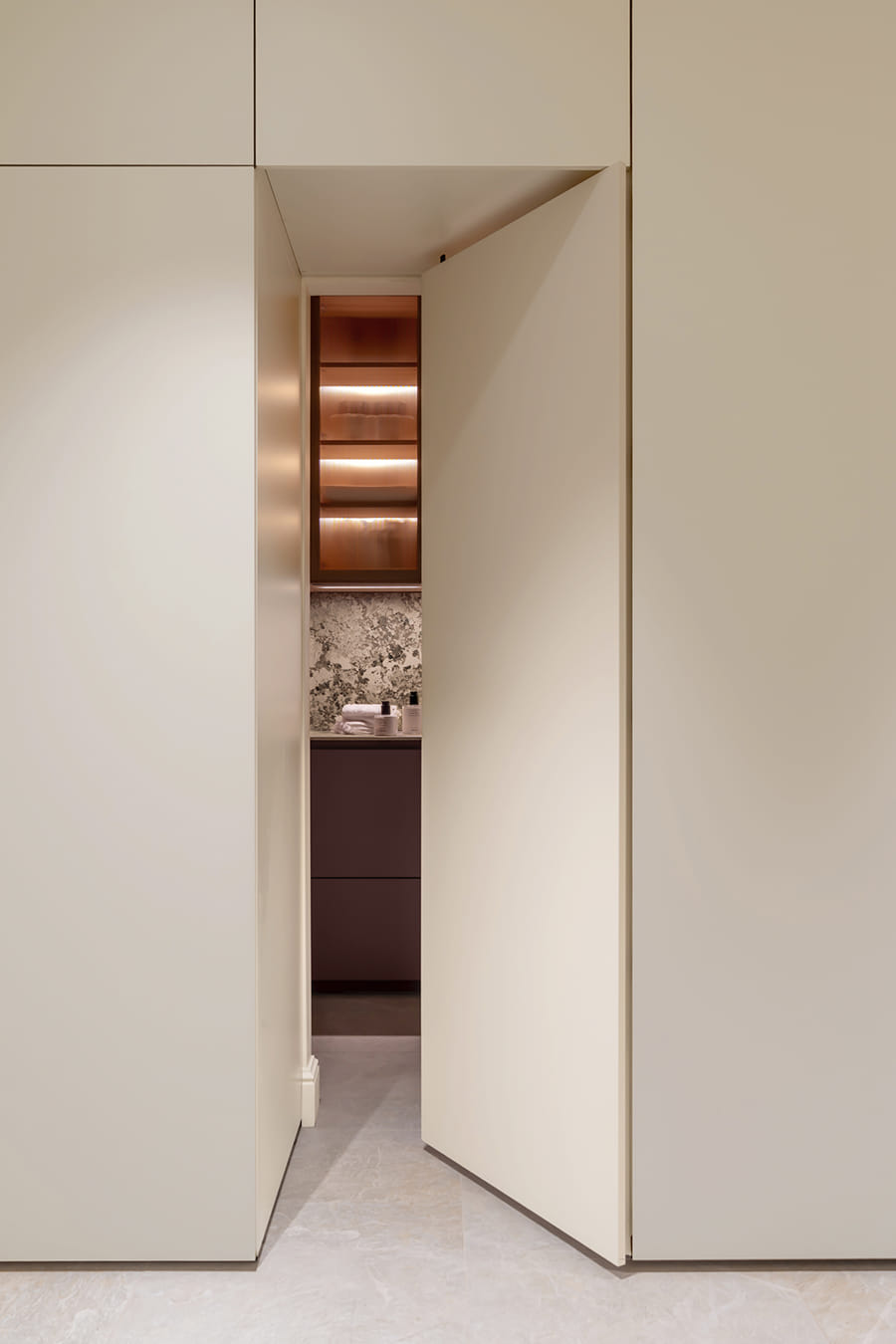 Laundry concealed behind pocket doors at the Santos Kitchen showroom in Switzerland.