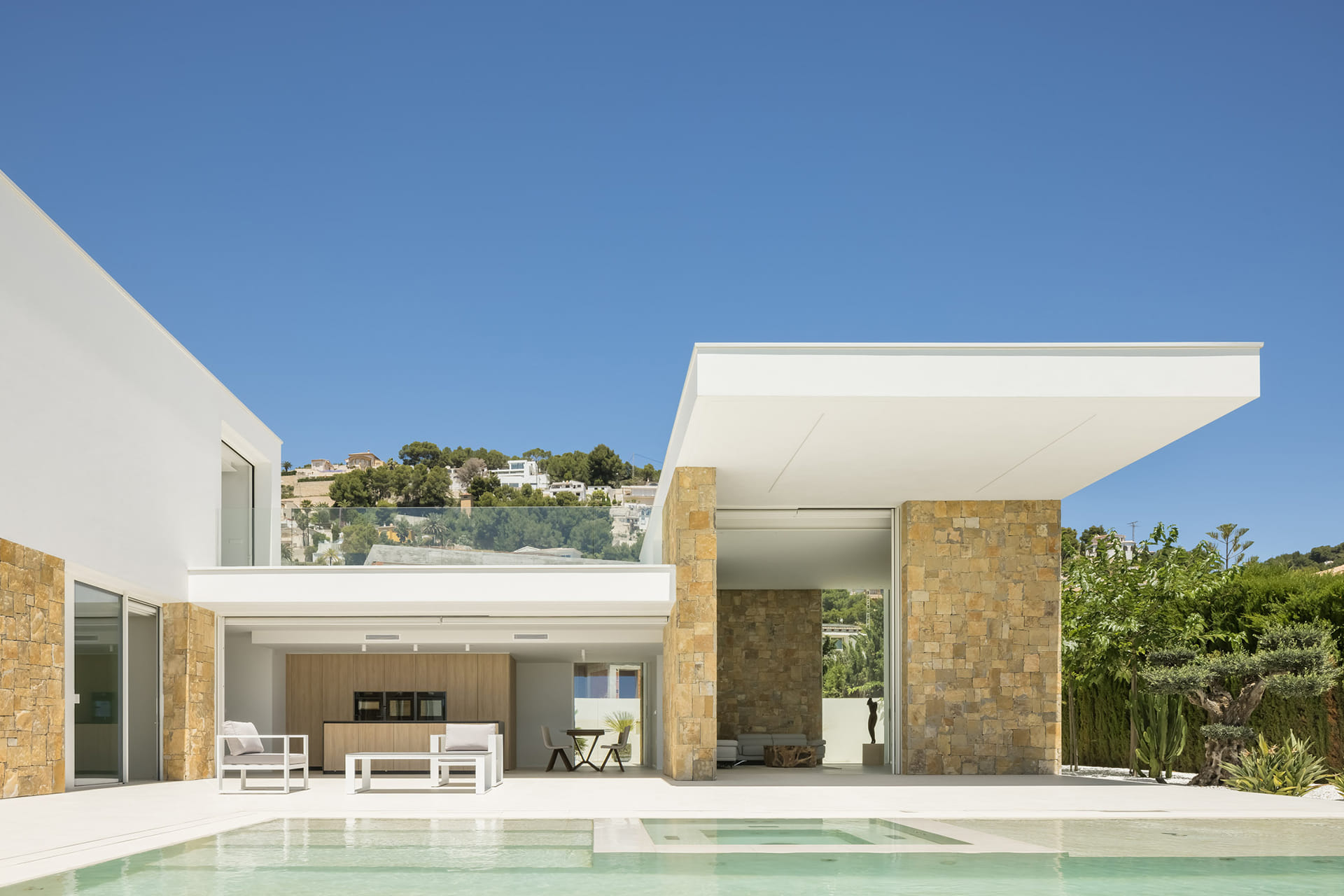 Home with Santos kitchen open to a very large outdoor area.
