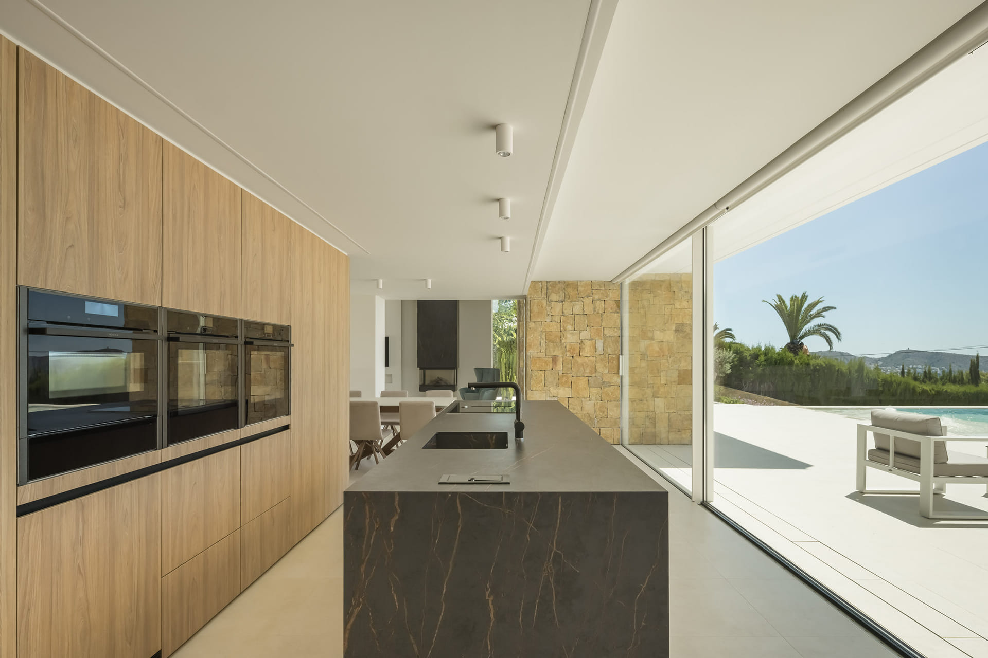 Home with a Santos kitchen open to a spacious outdoor area.