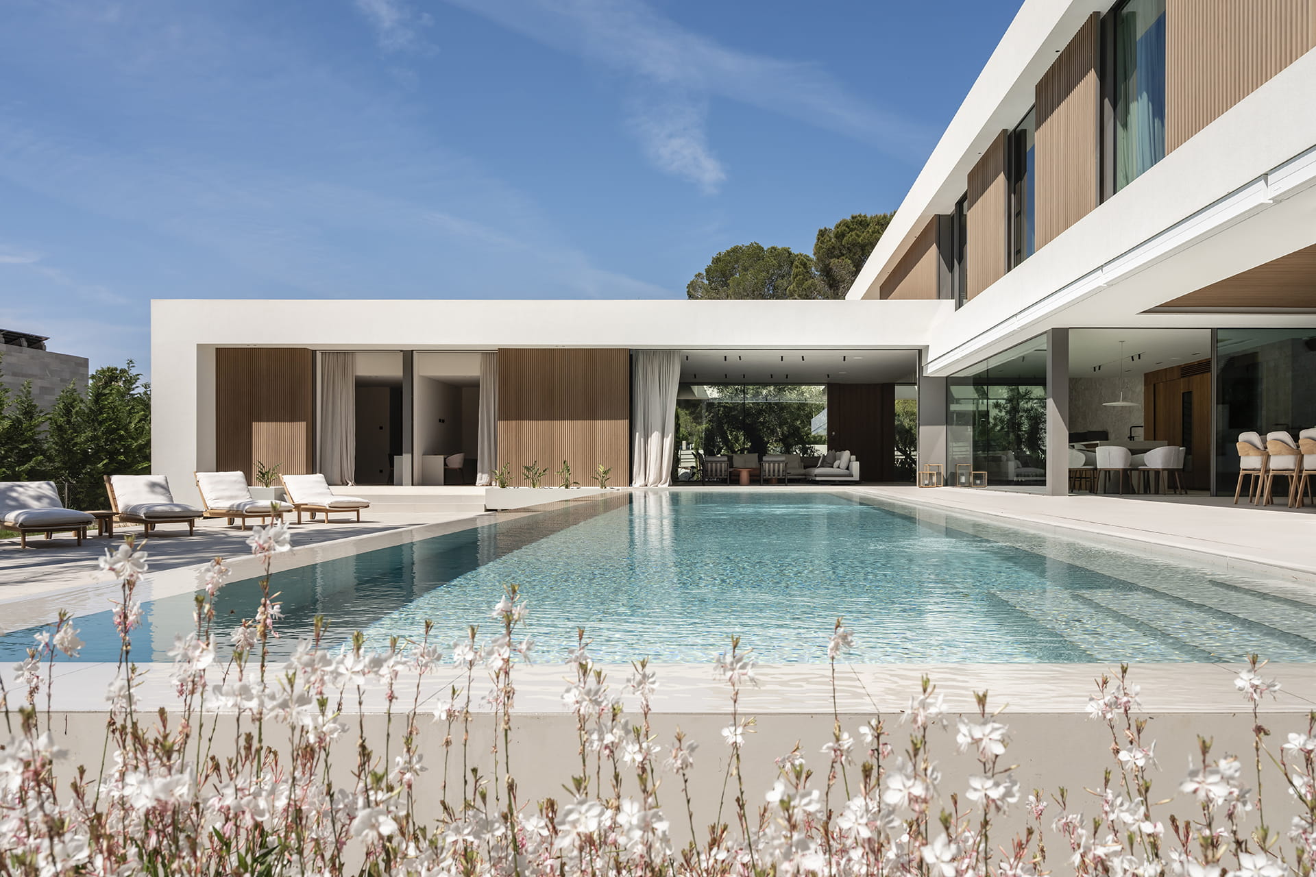 Outdoor area with pool in a home that features a Santos kitchen.